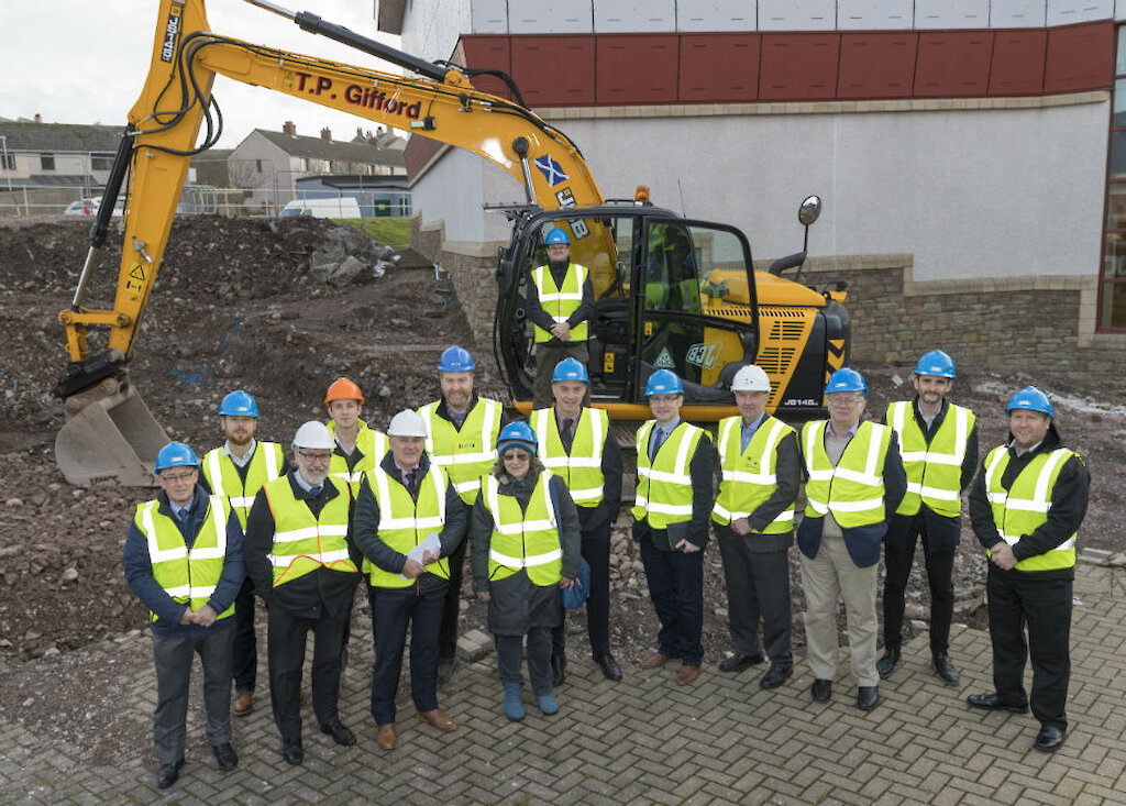 From left: Graham Kerr (J Duguid, QS), David Thomson (Trustee), Peter Johnson (PJP Architects), Karl Bolt (DITT Site Agent), James Johnston (General Manager, SRT), John Tait (Director, DITT), Sheila Tulloch (Shetland LEADER Programme), Bryan Leask (Chairman, SRT), Andrew Lyall (Head of Assets and Business Support, SRT), Leigh Smith (Technical Services Manager, SRT), George Anderson (Mott McDonald), Neville Martin (Vice Chairman, SRT), Trevor Smith (Project Manager, Anderson High School, SIC), Robert Geddes (CLC Manager).